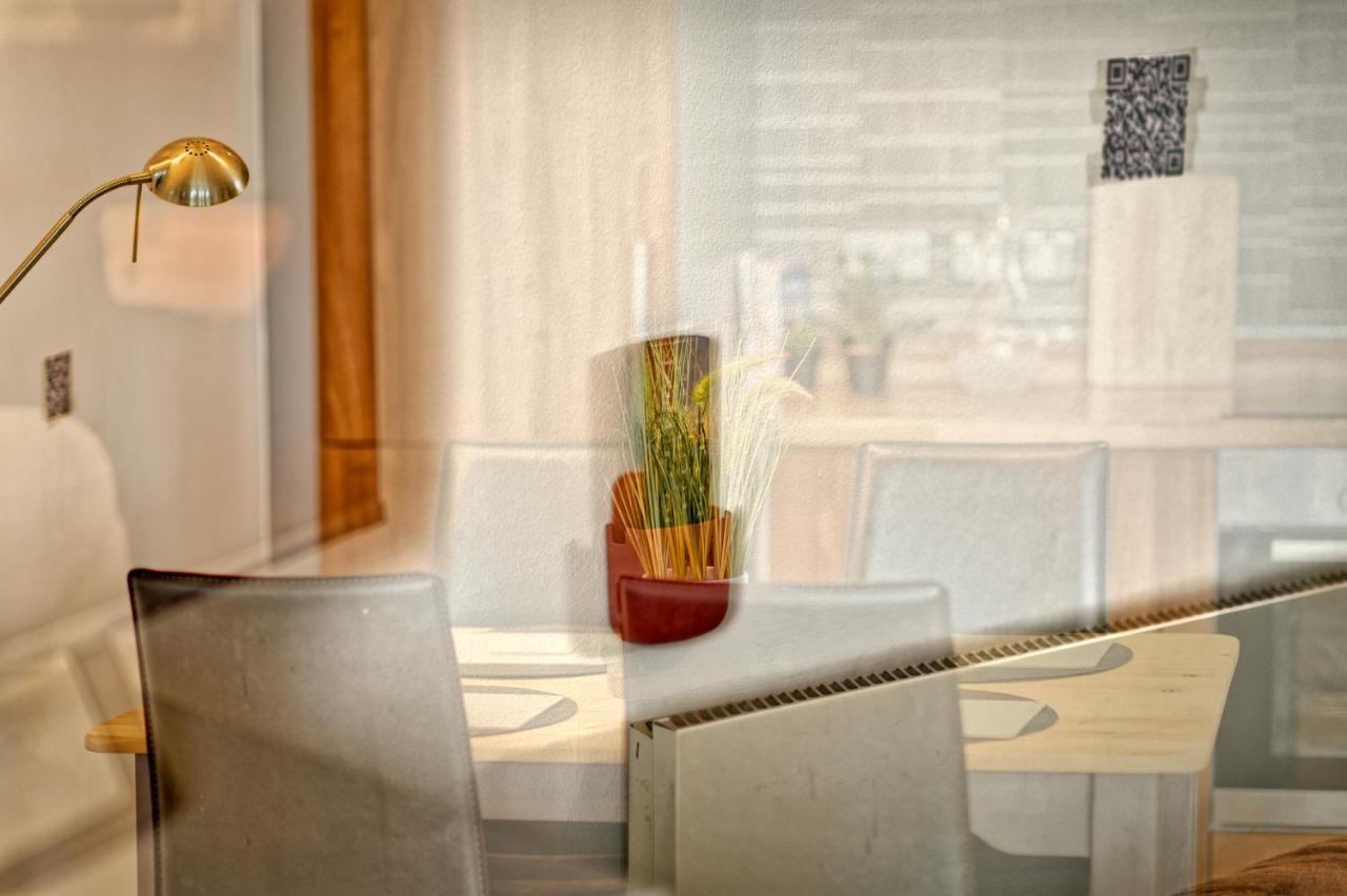 Dining table and lamp in the one-bedroom flat with a view, central Liverpool
