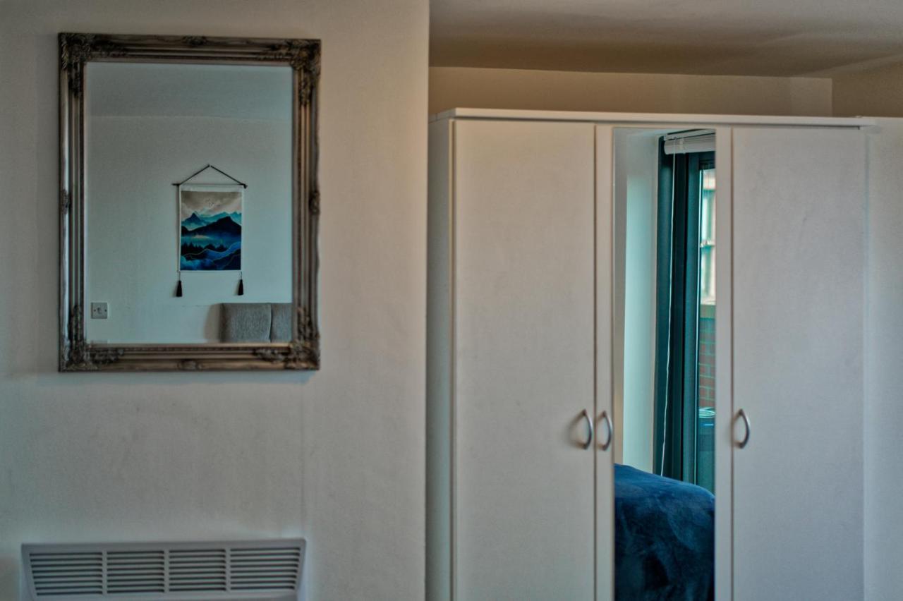 Mirror and wardrobe in the bedroom of the Liverpool apartment